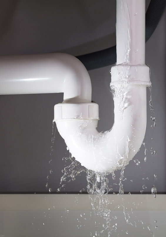 Close-up Of Water Is Leaking From The White Sink Pipe