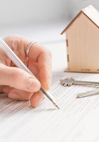 mortgage and housing rent. Keys, house and hand that signs documents. free space for text